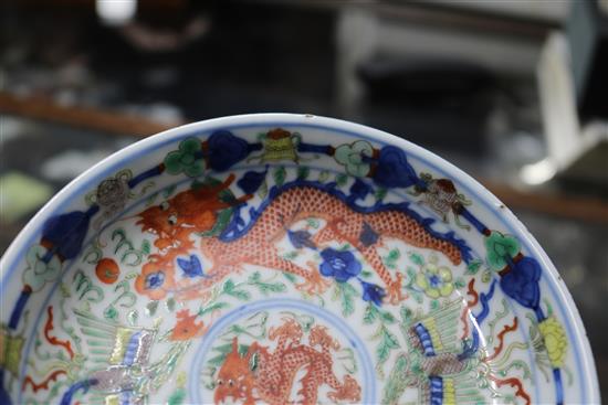 A Chinese wucai dragon and phoenix saucer dish, Kangxi mark, 19th century diameter 13.5cm